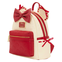 Cards & Comics Connection Minnie Mouse cream and red mini backpack with polka dot bow, satin ribbons, and 3D ears.