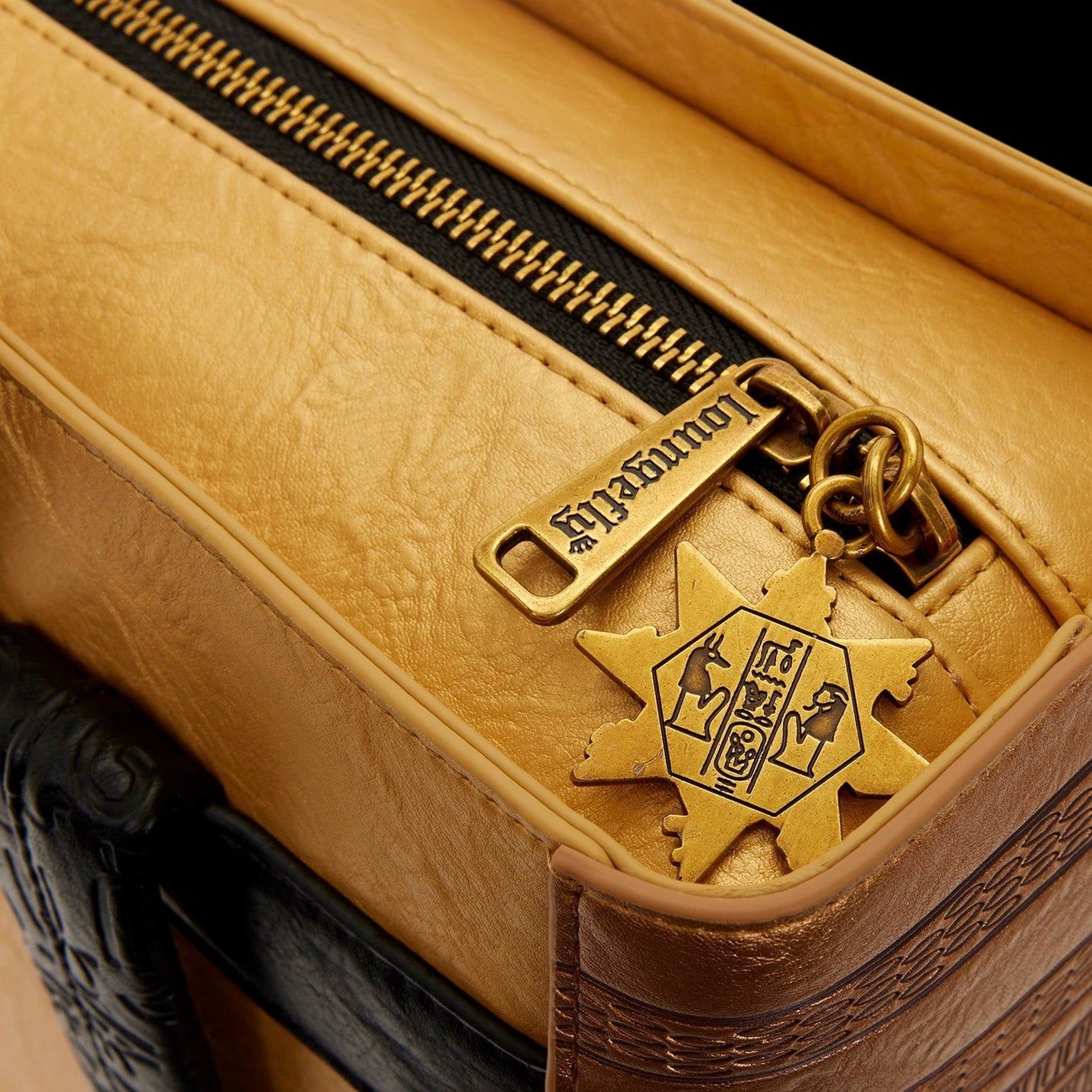 Cards & Comics Connection Loungefly The Mummy Book of the Living backpack featuring a metallic gold zipper charm