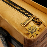 Cards & Comics Connection Loungefly The Mummy Book of the Living backpack featuring a metallic gold zipper charm